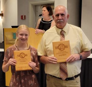 Kendall Snodgrass and Dan Cosgrove with awards